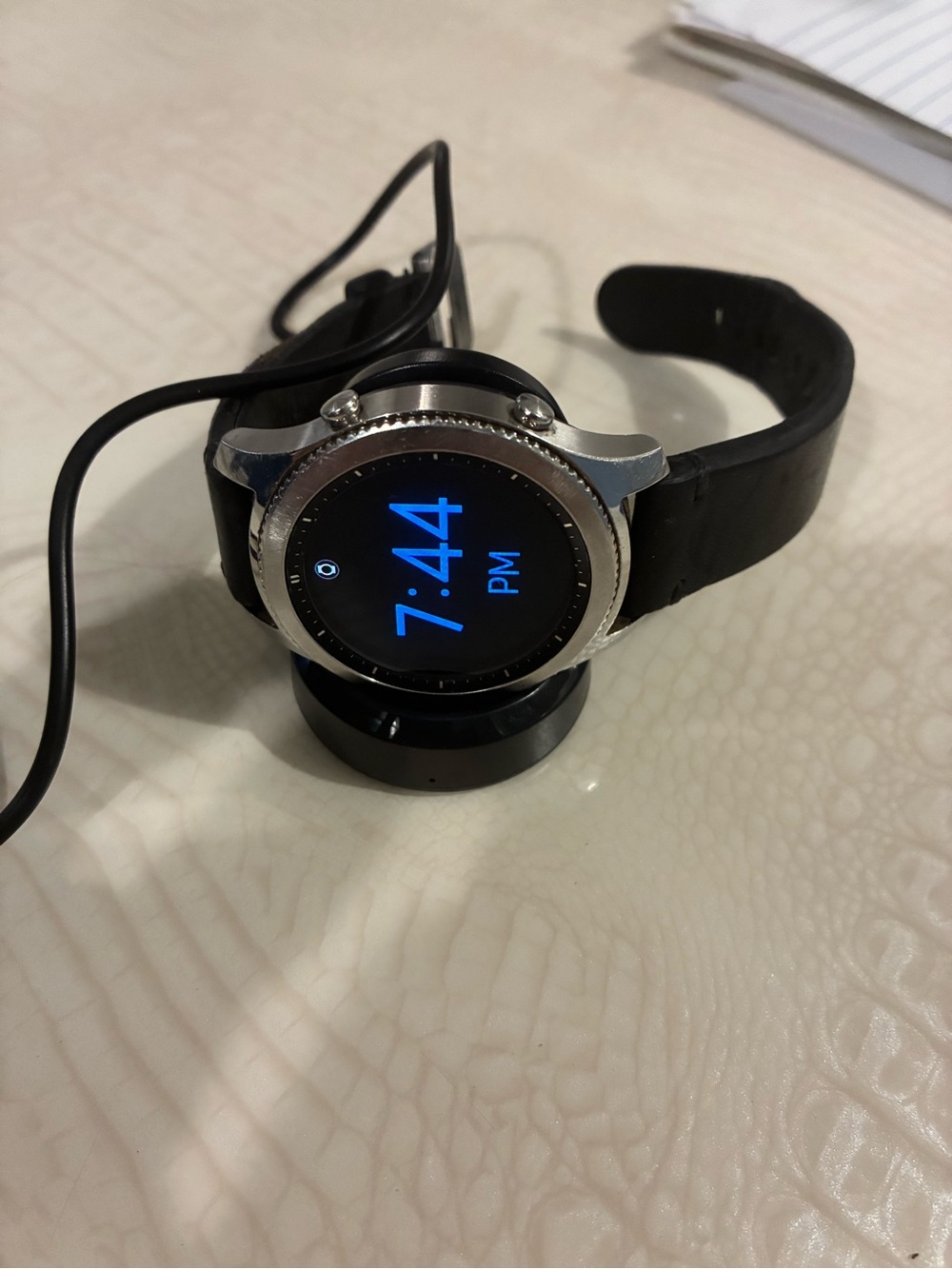 Samsung Silver Smartwatch with Black Strap and Blue Display